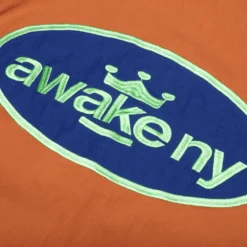 King Logo Twill Coaches Jacket - Rust -Urban Fashion Sales Awake NY King Logo Twill Coaches Jacket Rust AWK SP23 OT007 RUS 05 28 23 Feature KN 7