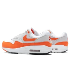 Nike Women's Air Max 1 '87 'Safety Orange' - Neutral Grey/Safety Orange/White -Urban Fashion Sales Nike Air Max 1 87 Women s Neutral Grey Safety Orange White DZ2628 002 10 08 23 Feature KN 5